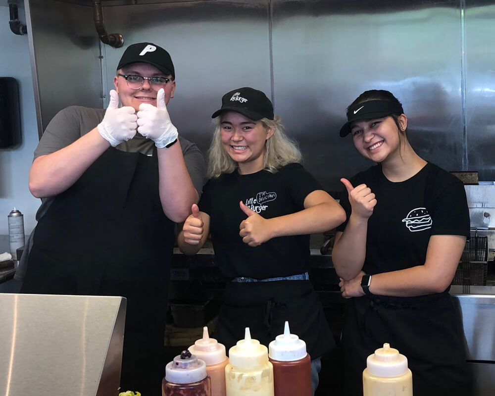 Kitchen staff giving a thumbs up